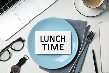 Business lunch. Office desk with plate, cutlery and laptop, flat lay. Card with phrase Lunch Time on dish