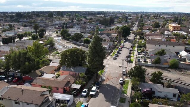 2023 - Excellent aerial footage of a neighborhood in Watts, Los Angeles, California, including a soccer field.