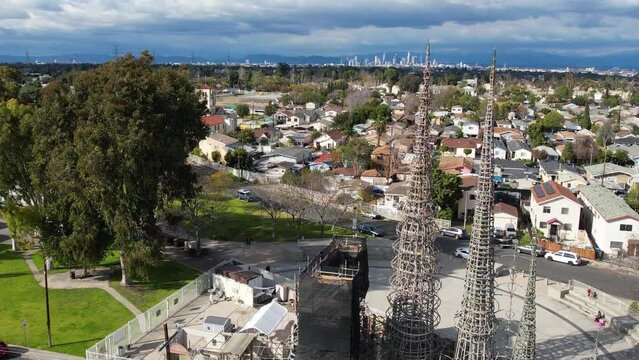 2023 - Excellent aerial footage over Watts Towers heading towards the adjoining neighborhood in Los Angeles, California.