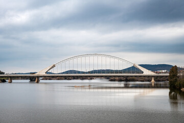 Wide-angle view of the modern Lusitania bridge over the Guadiana River in Merida, Spain.