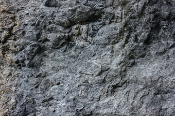 Grey stone wall in the Slovenian mountains close up. Stone texture and background