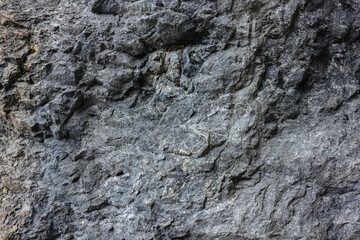 Grey stone wall in the Slovenian mountains close up. Stone texture and background