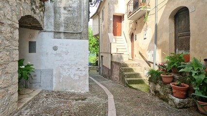 Fototapeta na wymiar A narrow street of Macchia d'Isernia, a medieval village in the mountains of Molise., Italy.