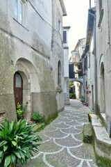 Fototapeta na wymiar A narrow street of Macchia d'Isernia, a medieval village in the mountains of Molise., Italy.