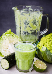 A green smoothie made with cabbage, lime,cucumber