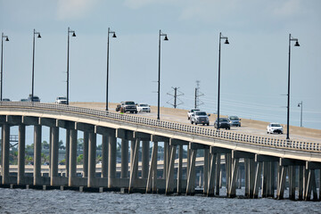 Barron Collier Bridge and Gilchrist Bridge in Florida with moving traffic. Transportation...