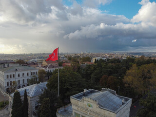 Turkish flag over Bosphorus boats, mosques, and minarets of Istanbul, Turkey