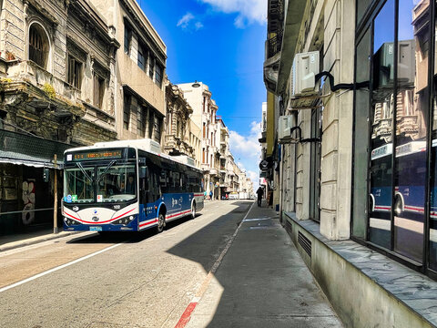 montevideo, uruguay - October 31 2022: public transport bus is driving on the street in the ciudad vieja transporting people