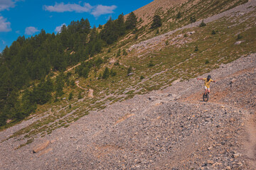 A unicyclist in the French Alps, on the way to Col du Cros
