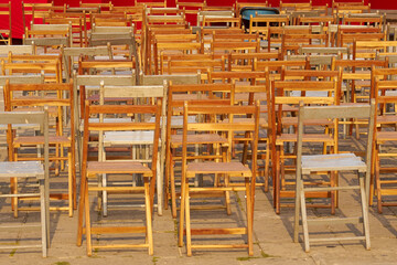 Old wooden chairs outside as a background.
