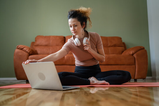 One Woman Doing Guided Meditation Yoga Self Care Practice At Home