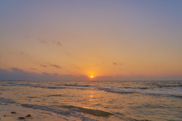 Fototapeta na wymiar A colorful sunrise on the Caribbean coast on the Mexico.