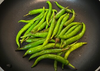green chilis in a frying pan
