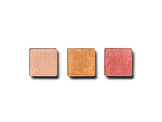 Eye shadow pans nude gold pink isolated on white background. Cosmetic product swatch