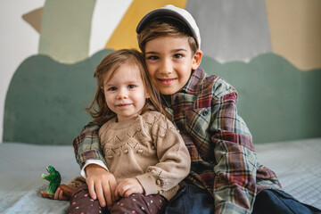 siblings portrait caucasian boy and girl brother and sister at home