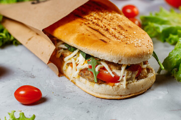 panini sandwich with crispy chicken and rucola salad