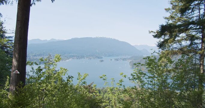 Handheld shot of Burrard Inlet from Burnaby Mountain Park (Burnaby Mountain Conservation Area) in sunny day.