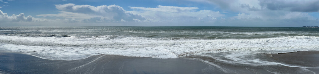 Fototapeta na wymiar Ocean Beach in Aptos California Panoramic Banner with Waves Sand and Clouds in a Blue Sky