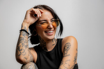portrat of a Gen Z tattoo girl laughing - 604483296