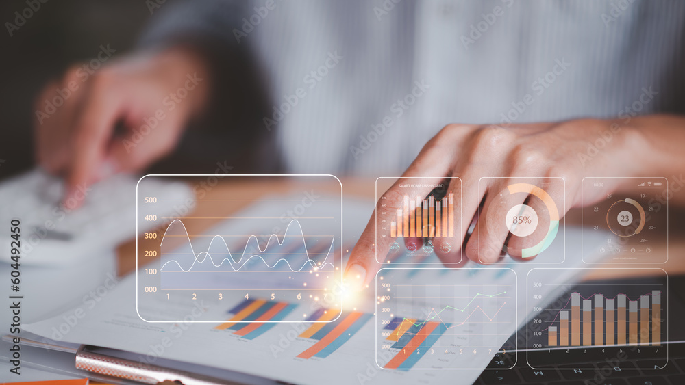 Aufkleber A man read and calculate business statistical chart reports to analyze and improve corporate strategy ,Manage financial and marketing documents, Company growth information ,Managing Business Insights