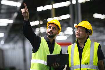 technician, supervisor with a senior foreman holding a walkie-talkie to command or inspect work...