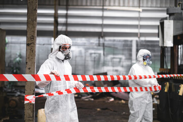 Officers wearing masks and gas masks, shut down areas where chemical spills in industrial plants.