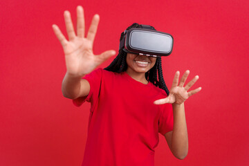 Happy african woman with Virtual Reality goggles