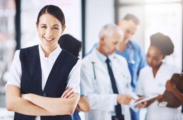 Healthcare, hospital and portrait of woman with arms crossed, smile and happiness with support in clinic. Health care, manager and medicine, confident and happy face of nurse or medical professional.