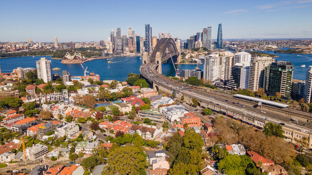 Aerial drone view of Sydney City and Sydney Harbour Bridge, NSW Australia looking over Kirribilli on a sunny morning 