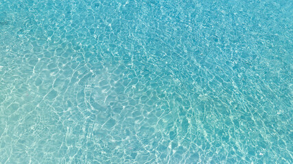 Aerial view of the Overhead view of crystal clear water on beach background