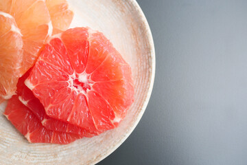 Fresh grapefruits on a plate 