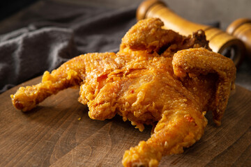Fried chicken on a wooden cutting board