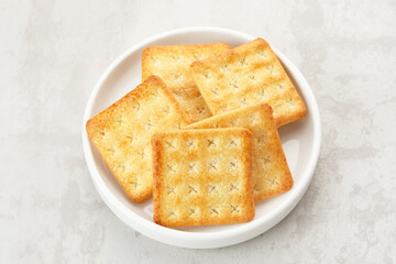 Sugar coated biscuits, also known as malkist, sweet and crispy. Served on white plate
