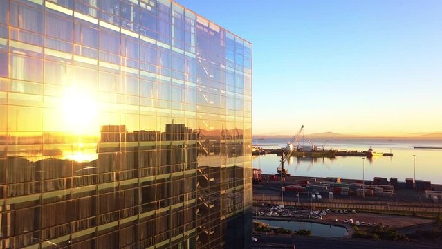 Drone, building and city skyline or CBD in an urban town and a location with infrastructure or development by the sea. Ocean, coastline and cityscape of New York in the morning sunrise for a vacation