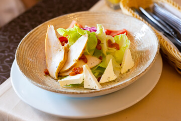 caesar salad with chicken and dehydrated sea buckthorn