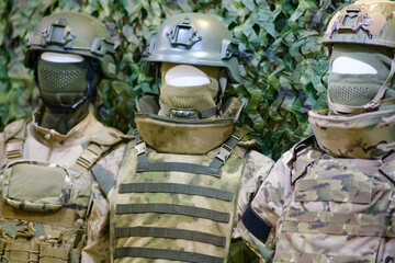 Military uniform on a mannequin as a sample for sale in a store. An army headdress worn on a...