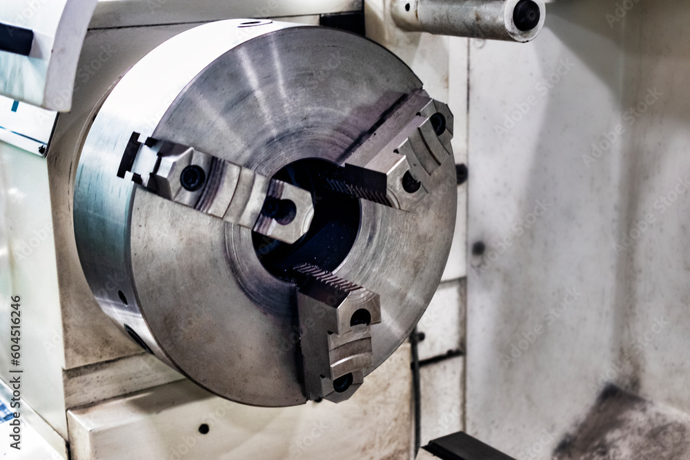 Poster an element of a lathe for fixing a metal part for processing. industrial processing of metal product
