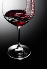 Closeup of red wine pouring.
