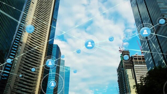 Animation of network of digital icons against low angle view of tall buildings and blue sky