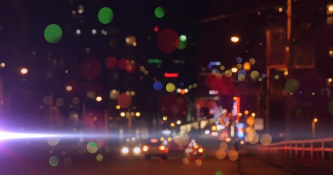 Animation of network of multi coloured balls over out of focus city lights