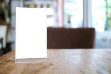 Menu frame standing on wood table in Bar restaurant cafe. space for text marketing promotion.
