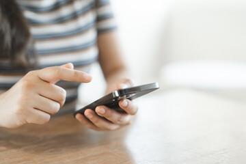 Women's Hands holding cell telephone working mobile devices. smart phone technology e-commerce concept