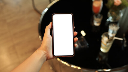 Women's hands holding cell telephone blank copy space screen. smartphone with blank white screen isolated on white background . smart phone with technology concept