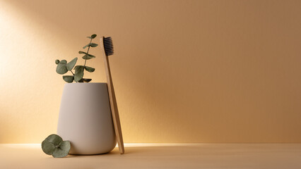 Eco-friendly bamboo toothbrush in a white glass