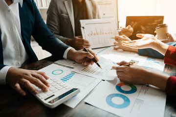 Team business meeting presentation. Hand businessman working project in modern office.Laptop computer and tablet and smart phone on white desk