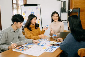  UX developer and ui designer brainstorming about mobile app interface wireframe design with...