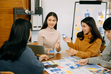  UX developer and ui designer brainstorming about mobile app interface wireframe design with...