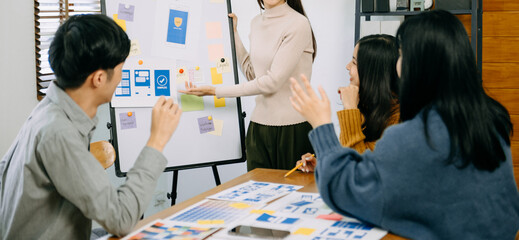 UX graphic designer planning application process development prototype wireframe for web smart phone. Creative digital development agency. in office