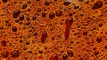 Oil bubbles in the water on a colored background. Colorful pattern of oil in water. Abstract liquid backdrop