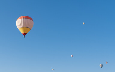 The hot air balloons flying above Goreme park, Sunrise time, Cappadocia, Turkey